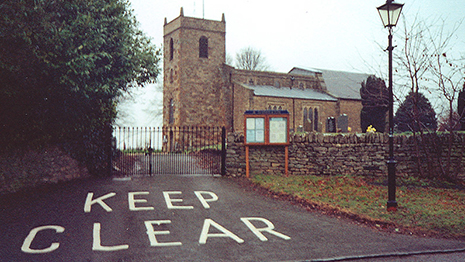 Photo of church with a big keep clear sign outside